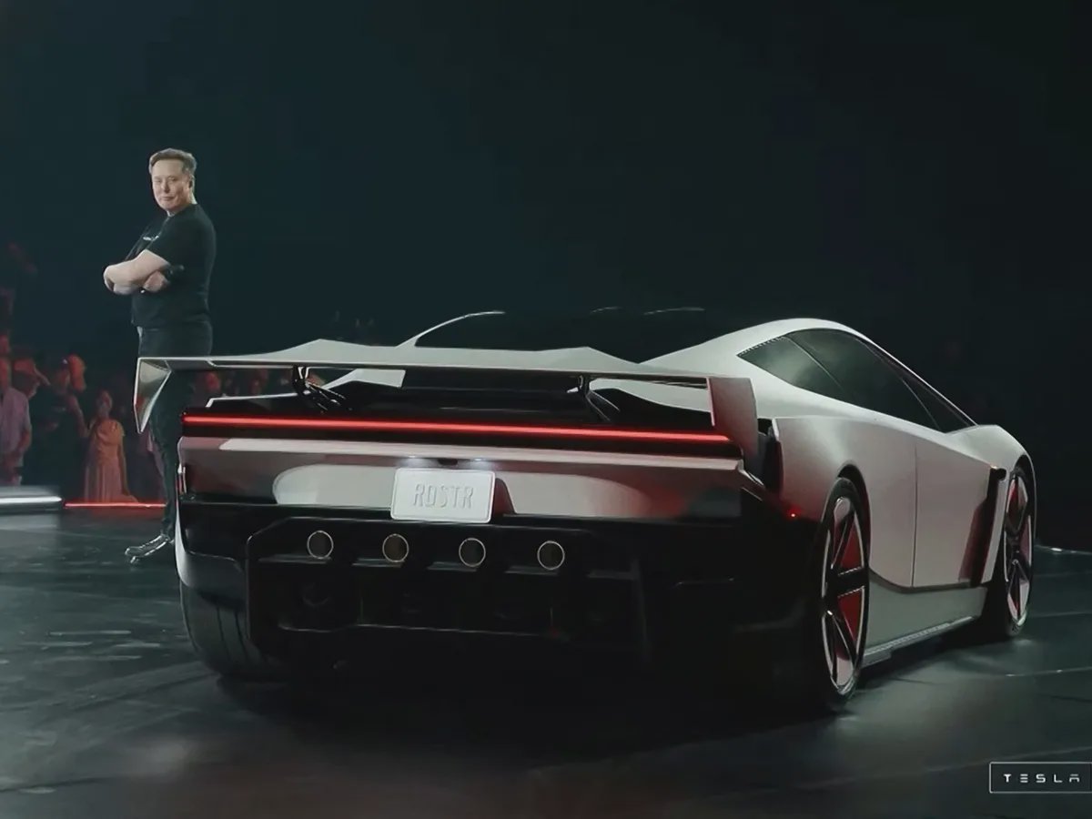 Elon Musk on stage with the Roadster prototype at the SpaceX McGregor facility, October 15 2026